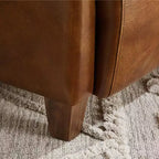 Fauteuil Art Leon en cuir avec design matelassé pour un confort intemporel