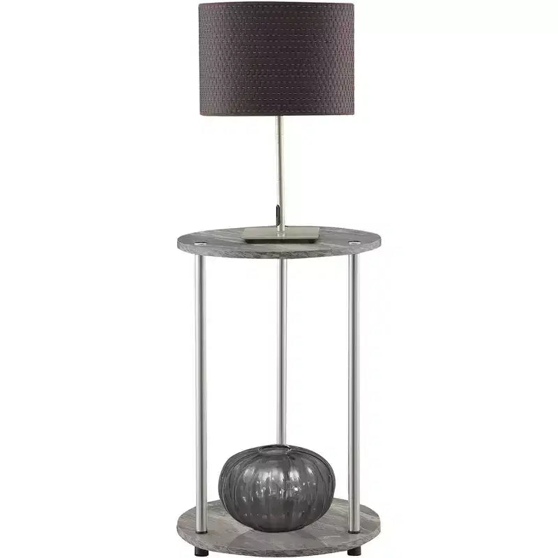 Table d'appoint ronde à deux niveaux HomeStock Belmont avec pieds en acier inoxydable, étagères robustes en panneaux de particules et style moderne contemporain.