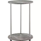 Table d'appoint ronde à deux niveaux HomeStock Belmont avec pieds en acier inoxydable, étagères robustes en panneaux de particules et style moderne contemporain.