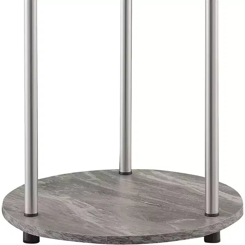 Table d'appoint ronde à deux niveaux HomeStock Belmont avec pieds en acier inoxydable, étagères robustes en panneaux de particules et style moderne contemporain.