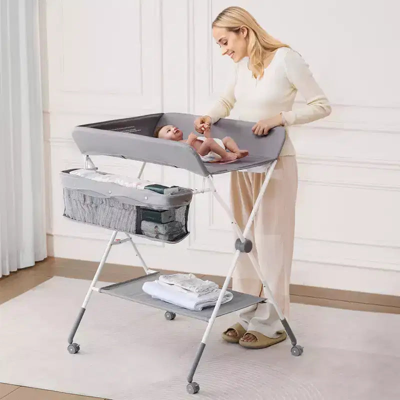 Table à langer VEVOR, Station à langer pliable avec panier latéral, Roues verrouillables, Organisateur de rangement multifonctionnel pour chambre d'enfant, Gris clair